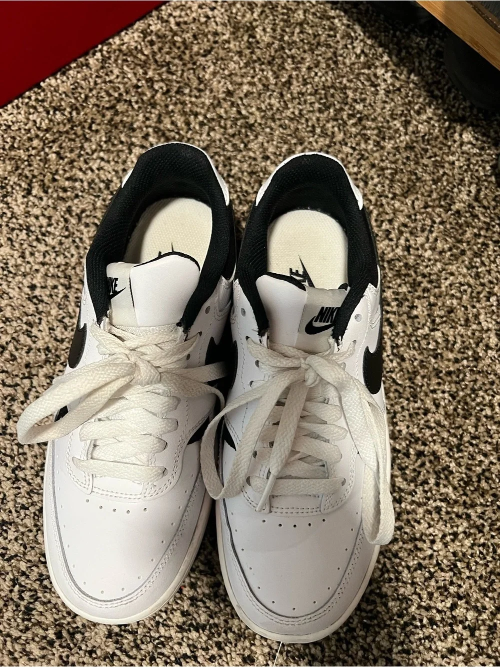 Nike Women's White Sneakers with Black Swoosh